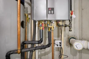 Furnace secondary heat exchanger leaking water in High Shoals NC: wall-mounted tankless water heater installed
